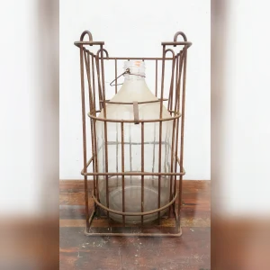 Antiquity20Revealed20A20Rustic20Metal20Crate20Displaying20a20Vintage20Glass20Bottle - ANTIQUITIESWAREHOUSES