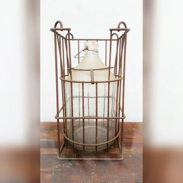 Antiquity20Revealed20A20Rustic20Metal20Crate20Displaying20a20Vintage20Glass20Bottle - ANTIQUITIESWAREHOUSES