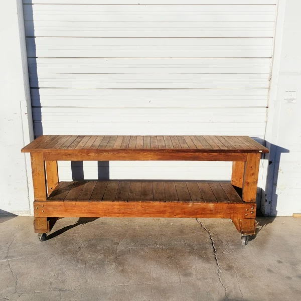 The20kitchen20island20features20a20rustic20wood20worktable20with20a20shelf20for20storage - ANTIQUITIESWAREHOUSES